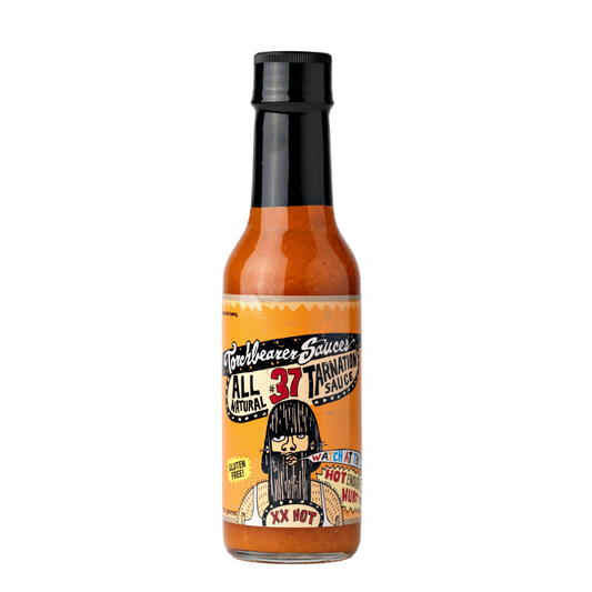 Hot sauce bottle with a colorful label on a white background