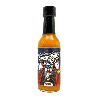 Bottle of garlic hot sauce with a colorful label on a white background