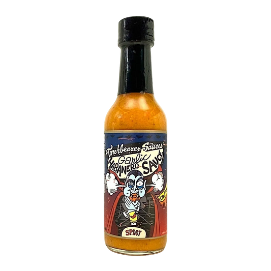 Bottle of garlic hot sauce with a colorful label on a white background